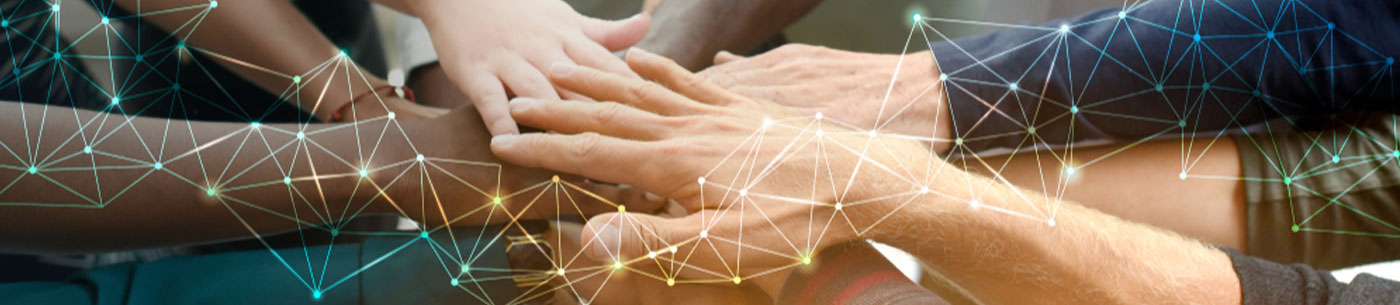 business professional joining hands with a network graphic overlay
