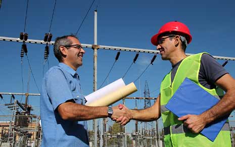 electric company workers at a substation